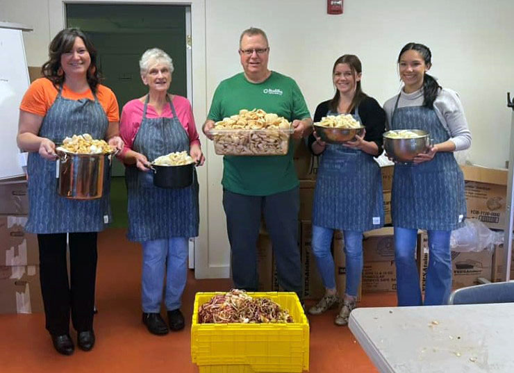 Volunteers make applesauce at the Rising Tide Co-op's community kitchen in Damariscotta. (Photo courtesy Healthy Lincoln County)