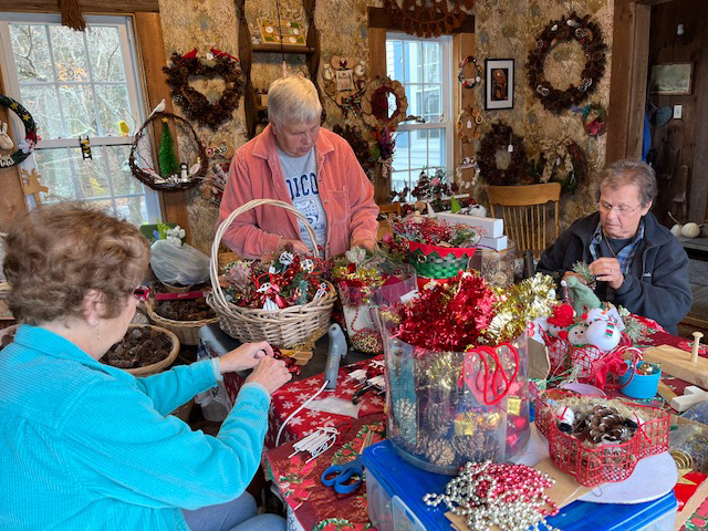 Led by Betty Lou Townsend, center, Beacon Chapter #202 Craft Club members, Nylene Page (left) and Joan Hodgdon, make Christmas decorations to be sold at the chapters Annual Christmas Bazaar. (Photo courtesy Fran Hewins)
