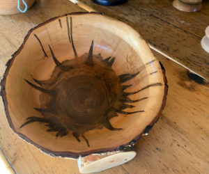 Find hand-turned bowls by Alna artist Dick Picard at the Wiscasset Holiday Marketfest Gift Shop, a pop-up business in the Nickels-Sortwell House barn on Federal Street, Dec. 24. The bowl shown in the photo is maple with a live edge. The coloration is a result of Ambrosia beetles. (Photo courtesy Sheepscot Turnings)