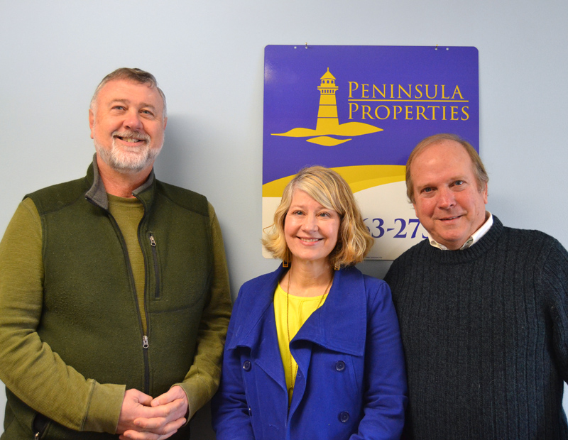 From left: Wayne Farrin, Alitha Young, and Jim Matel stand in the Peninsula Properties office in Damariscotta on Thursday, Dec. 21. Young and Matel, who have worked for Farrin Properties for the past few years, are opening their new real estate agency on Jan. 1. (Maia Zewert photo)