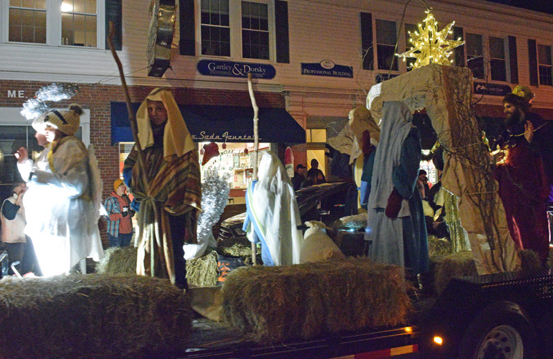 A living nativity scene created by Twin Villages Church rides through downtown Damariscotta during the Villages of Light parade on Saturday, Nov. 26. The church, located at 40 Church St. in Damariscotta, will recreate the living nativity scene outside the church from 4-7 p.m. on Sunday, Dec. 11. (Evan Houk photo)