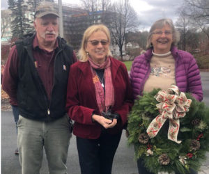 Wanda Wilcox (right) and her husband, Roger Wilcox, present her handmade wreath to Gov. Janet Mills on Monday, Nov. 28. Wilcox was invited to design a wreath for the governor's residence in Augusta as the first place winner in the decorated wreath category at the Fryeburg Fair this year. (Photo courtesy Wanda Wilcox)