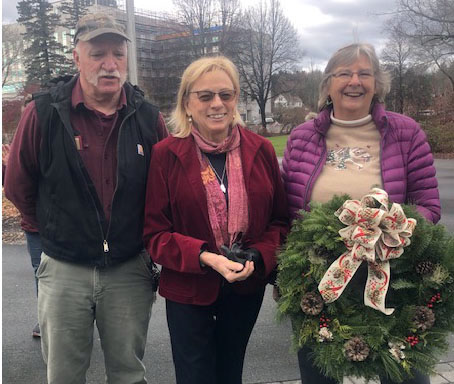 Wanda Wilcox (right) and her husband, Roger Wilcox, present her handmade wreath to Gov. Janet Mills on Monday, Nov. 28. Wilcox was invited to design a wreath for the governor's residence in Augusta as the first place winner in the decorated wreath category at the Fryeburg Fair this year. (Photo courtesy Wanda Wilcox)