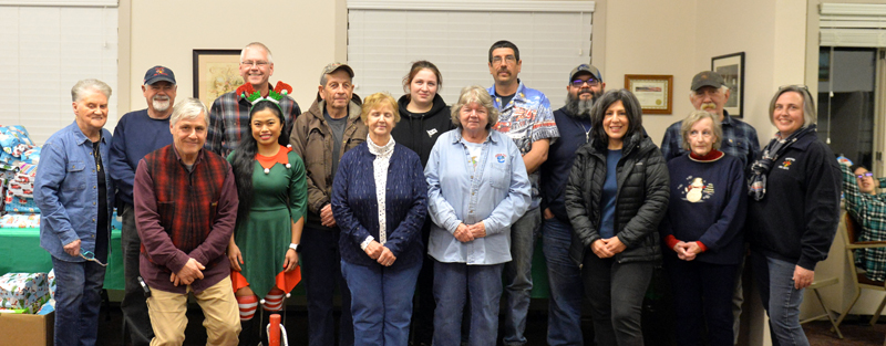 Bremen Fire Department members host a visit from Santa on Sunday, Dec. 11. It has been two years since the event was held, due to the COVID-19 pandemic. Front row, from left: Tom Papell, Rose Atkins, Joan Teele, Cathy Teele, Gracie Acosta, Margaret Johnson, and the Rev. Char Corbett. Back row, from left: Bonnie Poland, Bruce Poland, Dave Akers, Dave Teeele, Ann Teele, Eric Teele, Jaime Acosta, and Bruce Johnson. (Paula Roberts photo)