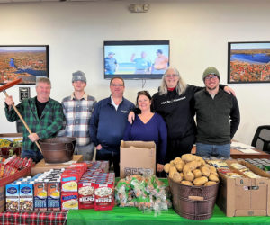 Members of the Wiscasset Ford pose before opening for their first food pantry. (Photo courtesy Healthy Lincoln County)