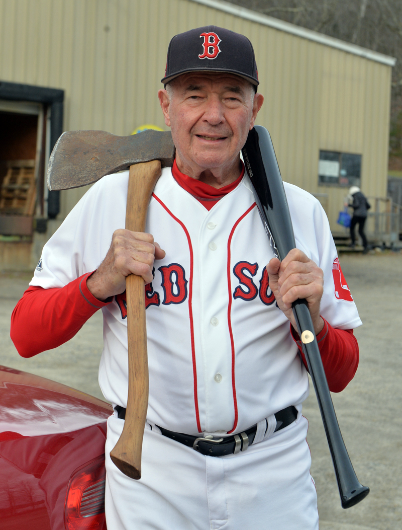 Bud Elwin, 83, of Walpole, holds an axe and an axe bat, similar to the one used by Ted Williams. (Paula Roberts photo)