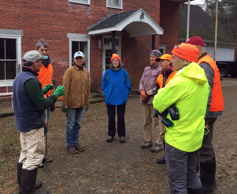 Carl Solberg organizes Sheepscot Knotweed Project volunteers. (Photo courtesy Kristin Stone)