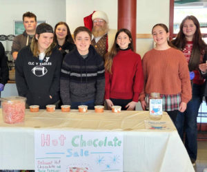 Lincoln Academy ninth graders who helped with the Villages of Light event in the LA Dining Commons Saturday, Nov. 19. From left: Sol Obregon, Cannon Smith, Kayden Correll, Emma-Leigh Moody, Greg Demerritt, Reese Nelson, Amelia Rice, Piper Lane Warfield, and Bailey Brewer. (Photo courtesy Lincoln Academy)
