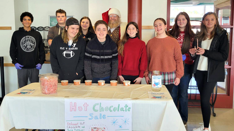Lincoln Academy ninth graders who helped with the Villages of Light event in the LA Dining Commons Saturday, Nov. 19. From left: Sol Obregon, Cannon Smith, Kayden Correll, Emma-Leigh Moody, Greg Demerritt, Reese Nelson, Amelia Rice, Piper Lane Warfield, and Bailey Brewer. (Photo courtesy Lincoln Academy)