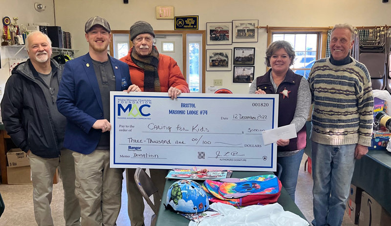 Members of the Bristol Masonic Lodge No. 74 present a donation to the Bristol based non profit Caring for Kids. Shown, from left: Masons Irving True, Dennis Boyd, and Secretary Bill Smith, Caring for Kids founder Jenny Pendleton, and Mason Jim Hazell. (Photo courtesy Jon Prime)