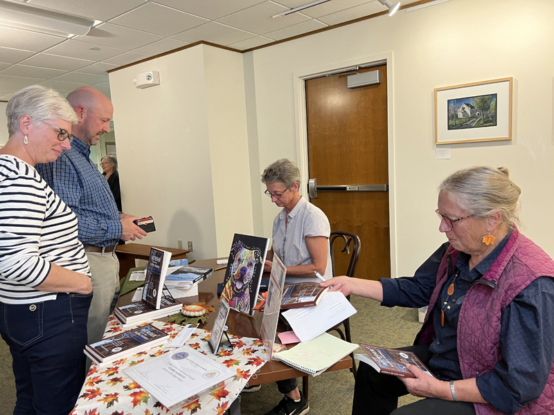 Laurie Apgar Chandler and Claire Ackroyd visit with readers at Presque Isles Mark and Emily Turner Memorial Library. The authors will sign copies of their books at Shermans in Boothbay Harbor on Saturday, Dec 10 from 1 to 3 p.m. (Photo courtesy Laurie A. Chandler)