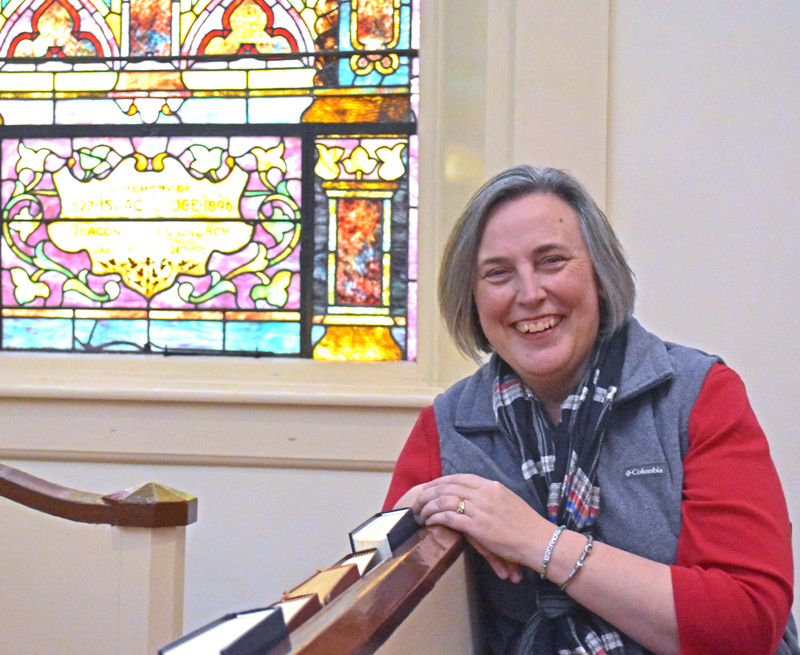 The Rev. Charlene Corbett, of Bremen, sits in the sanctuary of The Second Congregational Church of Newcastle, where she has served as pastor for six years. Corbett will begin a new position as executive director of Healthy Kids Damariscotta on March 1, a move she said was driven by a calling to be more available for her family. (Elizabeth Walztoni photo)