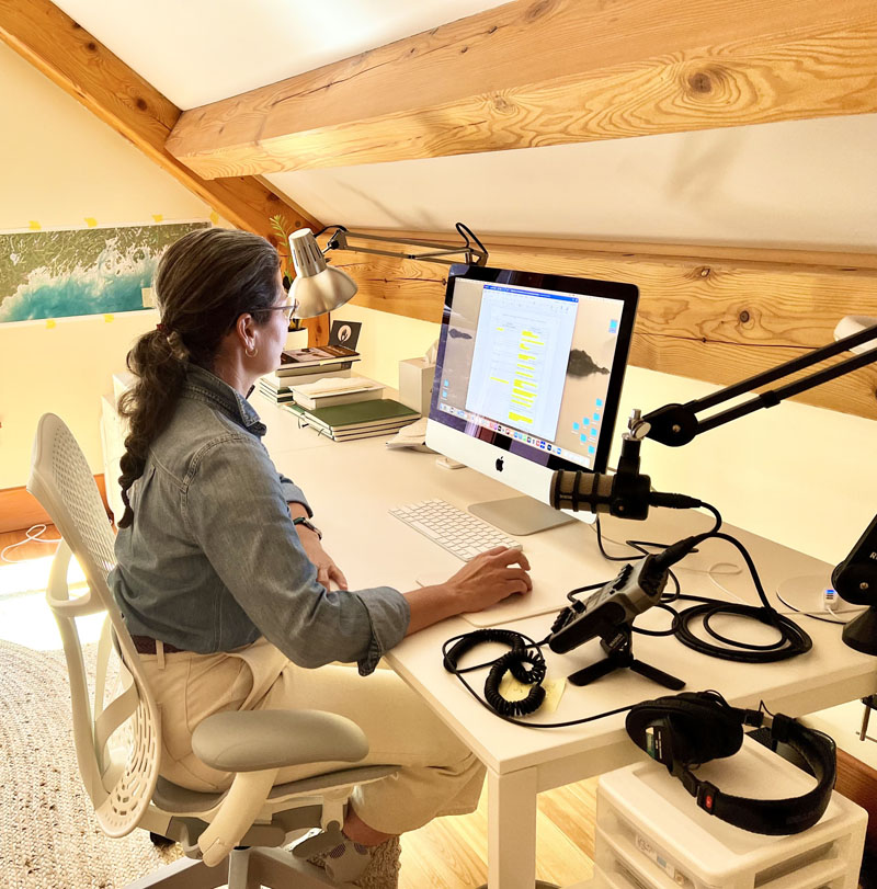 Emily Greenberg, host of "The Maine Conversation" podcast, edits an interview in her Bristol home studio. Nine episodes of the podcast were released in 2022, featuring conversations from across what Greenberg calls the "patchwork quilt" of Maine. (Photo courtesy Emily Greenberg)