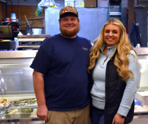 Gregory and Amy Simmons, of Friendship, stand in front of the seafood case in Simmons Seafood Market at 49 Main St. in Damariscotta. Gregory Simmons, a fifth-generation lobsterman, said the market idea came naturally from his career on the water, where he always thought about how to get his catch directly to customers. (Elizabeth Walztoni photo)