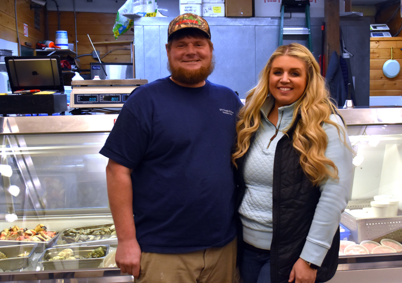 Gregory and Amy Simmons, of Friendship, stand in front of the seafood case in Simmons Seafood Market at 49 Main St. in Damariscotta. Gregory Simmons, a fifth-generation lobsterman, said the market idea came naturally from his career on the water, where he always thought about how to get his catch directly to customers. (Elizabeth Walztoni photo)