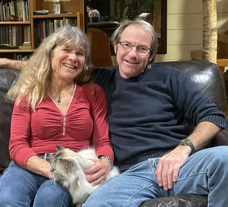 Jaja and Dave Martin relax at their self-built home in Bremen with their pet cat, Shackleton. After sailing the world for almost two decades, the Martin family arrived in Lincoln County in 2003 and found the community they were looking for. (Sherwood Olin photo)