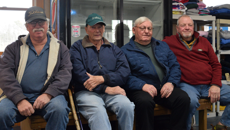Four South Bristol Fishermen's Co-op members pose for a photograph after an interview about the 50th anniversary of the co-op on Wednesday, Dec. 14. From left: Co-op President Chuck Plummer; original members Lewis Kelsey and Thurlow "Sonny" Leeman; and Tim Alley. (Evan Houk photo)