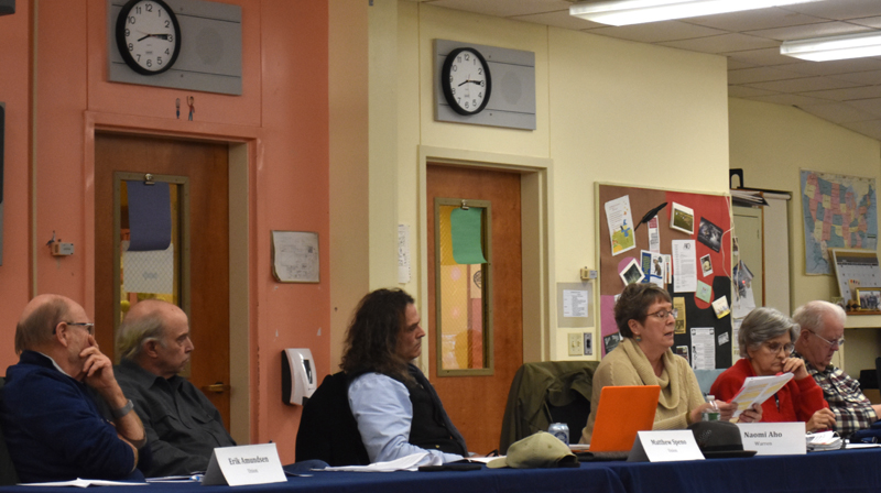 Members of the RSU 40 Board of Directors listen as Naomi Aho (third from right), of Warren, reads a prepared statement saying that students with gender questions should not receive accomodations at school. District Superintendent Steve Nolan said the district's new policy is intended to help schools follow the Maine Human Rights Act. (Elizabeth Walztoni photo)