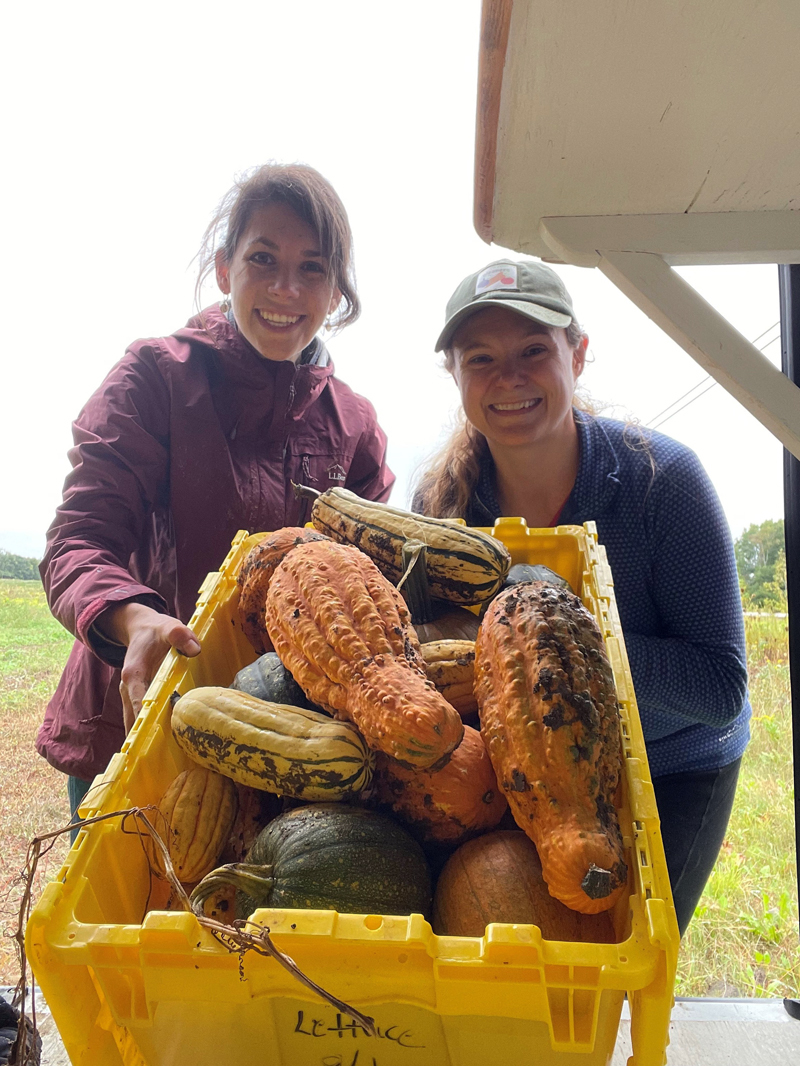 Larissa Hannan and Jess Breithaupt from Healthy Lincoln County show off their gleaned squash from Goranson Farm. (Photo courtesy Healthy Lincoln County)
