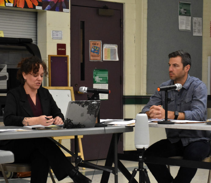 Great Salt Bay School Committee member August Avantaggio listens to AOS 93 Superintendent Lynsey Johnston at the committee's April 12 meeting as she reads a statement responding to a lawsuit filed against school officials. Johnston, who is one of the defendants, said defendants were confident former GSB parent Amber Lavigne would not win her case. (Elizabeth Walztoni photo)