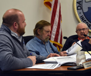 From left: Town Manager Andy Dorr reviews documents with Damariscotta Select Board members Tom Anderson and Lou Abbotoni during the board's meeting on Wednesday, April 5. (Elizabeth Walztoni photo)