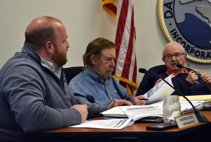 From left: Town Manager Andy Dorr reviews documents with Damariscotta Select Board members Tom Anderson and Lou Abbotoni during the board's meeting on Wednesday, April 5. (Elizabeth Walztoni photo)