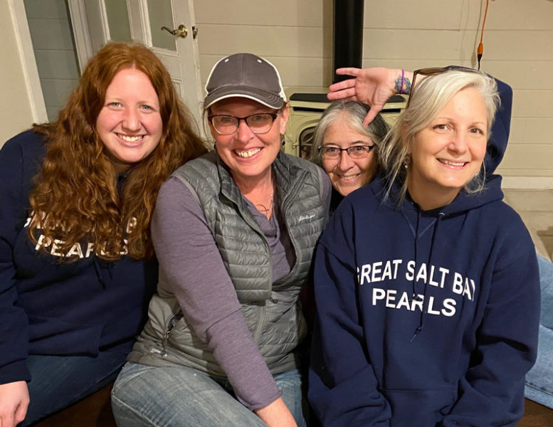Members of the Great Salt Bay Pearls toboggan team who once competed in the world championships at the Camden Snow Bowl. From left:  Tracy Sitarski, Jen Wright, Janet Dempsey, and Kellie Peters. Peters has helped Sitarski buy a house and Wright buy and sell a house, two of the six of her GSB colleagues she has represented in real estate transactions. We joke that Im GSBs personal real estate broker, Peters said. (Photo courtesy Kellie Peters)