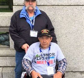Honor Flight Maine veteran, U.S. Army Ronald Poland, seated, and Guardian Air National Guard Veteran Forest Faulkingham at the World War II Memorial in Washington D.C. Saturday, April 29. (Photo courtesy Forest Faulkingham)