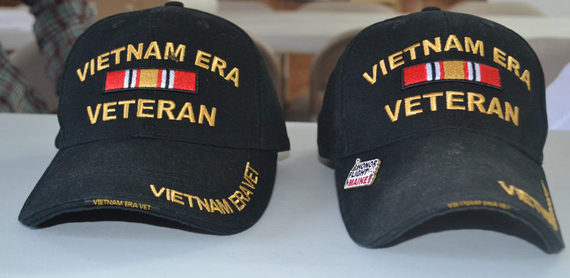 Veterans' caps worn by Ronald Poland and Forest Faulkingham during their recent Honor Flight Maine trip to Washington D.C. indicating they served during the Vietnam era but not in Vietnam. (Charlotte Boynton photo)