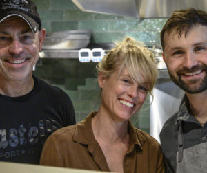From left: restaurant owners Warren Busteed, Beth Polhemus, and Florin Ungureanu, pose for a photo in the kitchen at Bred in the Bone in Damariscotta on Friday, May 12. The restaurant is the latest offering from the trio who operate The Contented Sole in Pemaquid Harbor as well as Boothbay Harbor's Salty Boyz Food Truck. (Bisi Cameron Yee photo)