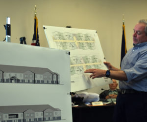 Steve Weatherhead of Winton Scott Architects presents plans for a 32-unit affordable senior housing development while the Damariscotta Planning Board looks on during a public hearing for the project on Monday, May 1. The development, approved with conditions, will subdivide an existing parcel containing the 24-unit Ledgewood Court affordable senior housing development. (Elizabeth Walztoni photo)