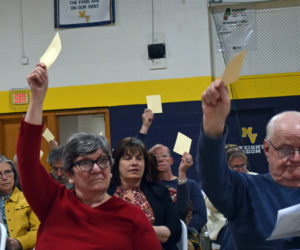 Residents of RSU 40's five member towns: Friendship, Waldoboro, Washington, Warren, and Union, vote on a budget warrant article in the Medomak Valley High School gymnasium on Tuesday, May 16. All articles were approved as presented at Tuesday's budget adoption meeting, setting a $37.2 million budget to come before voters in June. (Elizabeth Walztoni photo)