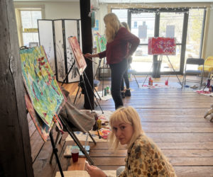 Attendees participate in crafts and painting at the Merry Barn. (Courtesy photo)