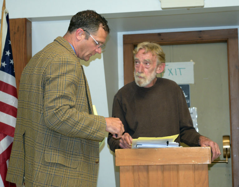 Attorney Benjamin J. Smith (left) confers with his client Ralph Hilton during Hilton's presentation at an ethics hearing involving Alna First Select Board member Ed Pentaleri Thursday, June 8. Hilton filed the complaint April 27, accusing Penatleri of a conflict of interest, bias, and perjury. (Sherwood Olin photo)