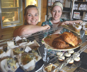 Crystal Berg (left) and Andrea "Annie" Leck stand behind a collection of Barn Door Baking Co. offerings in 2017. The longtime friends and business partners recently opened Barn Door Breakfast in downtown Damariscotta. (Maia Zewert photo, LCN file)