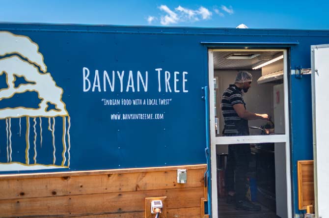 San Rudra, of Damariscotta, prepares food on Banyan Tree's opening day at Rising Tide Co-op on Sunday, June 11. (Photo courtesy Dan D'ippolito)