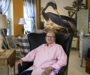 Willis Somoya, owner of The Shady Lady, sits in a leather chair in her new space in Damariscotta on Saturday. May 27. Somoya has reopened her shop in the former Citizen Maine location. (Bisi Cameron Yee photo)