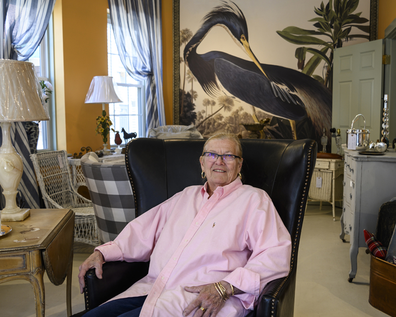 Willis Somoya, owner of The Shady Lady, sits in a leather chair in her new space in Damariscotta on Saturday. May 27. Somoya has reopened her shop in the former Citizen Maine location. (Bisi Cameron Yee photo)