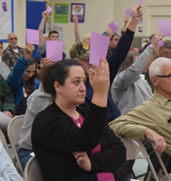 Dresden residents vote on an article during the annual town meeting at Dresden Elementary School on Tuesday, June 20. (Meira Bienstock photo)