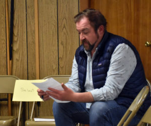 Michael Maxim reviews the warrant for a special town meeting on Tuesday, May 30 during a recess of the Edgecomb Select Board meeting, his first after winning the board seat on May 20. Lynn Norgang, elected at a special town meeting in April, joins him as a newcomer to the board. (Elizabeth Walztoni photo)