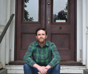 Matt Peters, one of the most recognized faces in the Twin Village restaurant scene, poses on the stoop of his Damariscotta home on June 3, where he lives with his fiancée, Lilia Hayford, and their affectionate and English Lab, Clara.