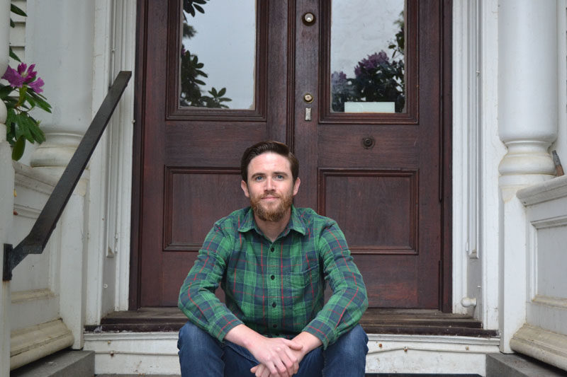 Matt Peters, one of the most recognized faces in the Twin Village restaurant scene, poses on the stoop of his Damariscotta home on June 3, where he lives with his fiancée, Lilia Hayford, and their affectionate and English Lab, Clara.