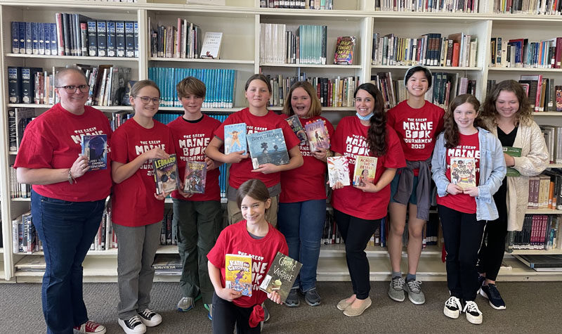 South Bristol School's Great Maine Book Tournament team became state champs on May 24. From left: Co-coach Erin Mower, students Monette Swall, Eddie Seiders, Aysel Fraser, Ava Larrabee Cotz, Helen Rice, co-coach Kayla Wright, Yzze Bhe, Carmella Fraser, and Helena Bigonia. (Photo courtesy Erin Mower)