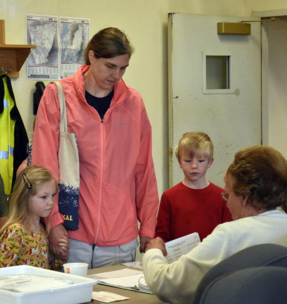 Melissa Butterfield checks in to vote at the Waldoboro fire station on Tuesday, June 13. (Elizabeth Walztoni photo)
