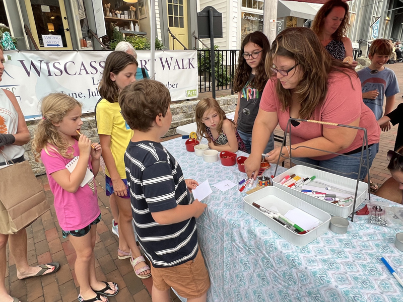 The Partners in Education table seen here was a very popular sidewalk stop at last year's Wiscasset Art Walk. (Photo courtesy Bob Bond)