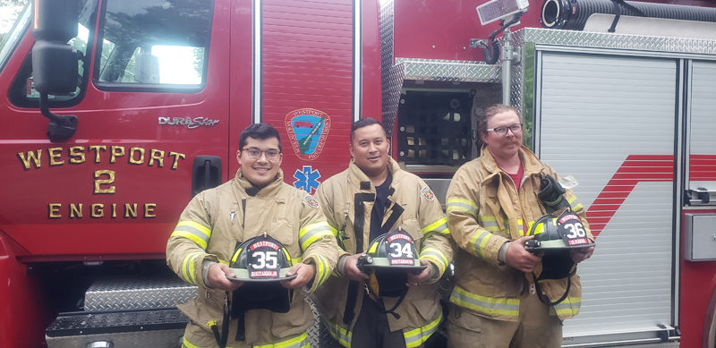 From left: Westport Island residents Joe Dikitanan Jr., Joe Dikitanan Sr., and Daniel "Fin" Kaeka celebrate after completing fire academy training. (Photo courtesy Chief Stacey Hutchinson)