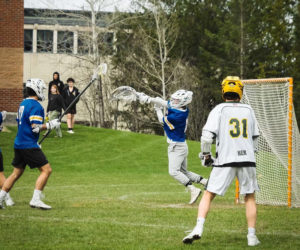 Will Farrell, in net, plays for the Maine Maritime Academy Mariners at Lyndon State College in Vermont. (Courtesy photo)