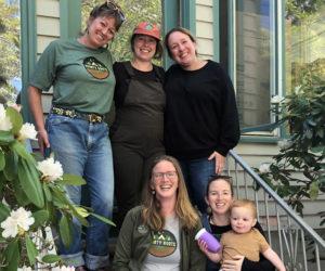 From left: Haley Bezon, Jess Donahoe, Lauren Cucci, Hannah Walsh, Lauren Talek, and young Rudy at Hearty Roots' new location in Damariscotta. (Photo courtesy Hearty Roots)