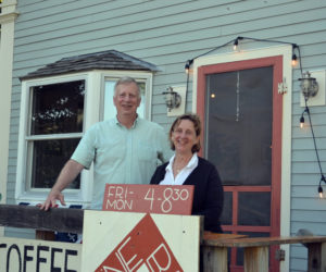 Tom Bishop and Sarah Matel stand in front of the building on Route 32 in Round Pond that houses both The Common House and Round Pond Coffee. The Common House is a beer and wine bar open from 4-8:30 p.m. Friday to Monday. (Johnathan Riley photo)