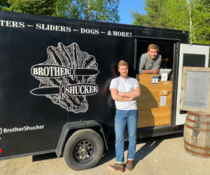 The owners of Brother Shuckers, Hudson Kuras (left) and Zak Kuras, pose outside of their food truck. Brother Shuckers will be one of the regular trucks at Oxbow Brewing Co. in Newcastle this summer. (Photo courtesy Josh Fernands)